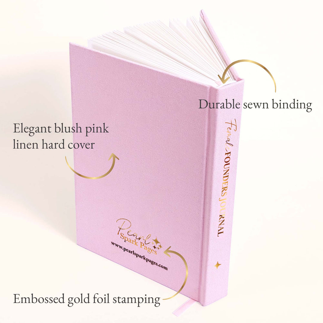 Blush pink linen Female Founders Journal by Pearl Spark Pages, featuring gold foil embossing and visible sewn binding on hardcover.