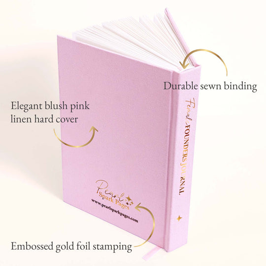 Blush pink linen Female Founders Journal by Pearl Spark Pages, featuring gold foil embossing and visible sewn binding on hardcover.